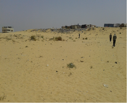 Field inspection of a sandy site for the Gaza Water Supply Improvement Project environmental review